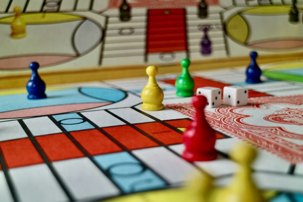 Colourful game pieces and dice on a board game